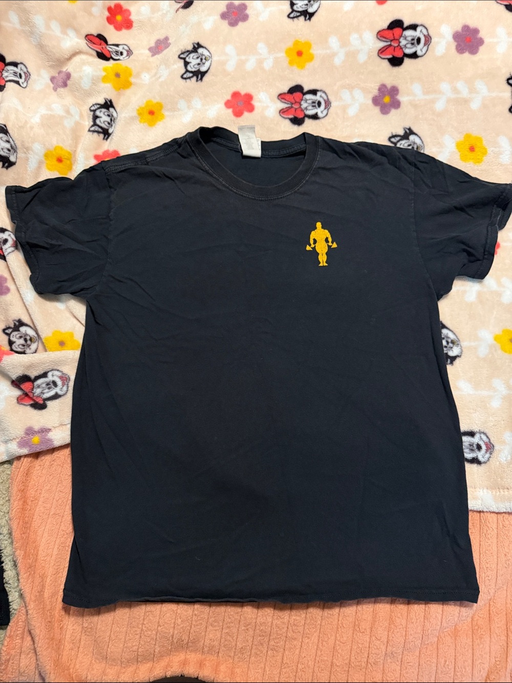 Men's Black Crew Neck Short Sleeve Tee with Yellow Figure Emblem
